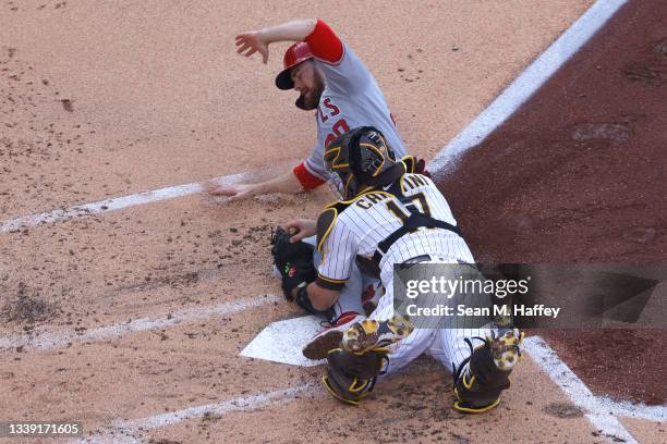 Jared Walsh of the Los Angeles Angels is tagged out by Victor Caratini of the San Diego Padres during the second inning of a game at PETCO Park on...