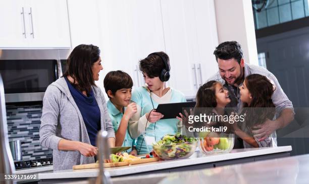 large multiracial family with four children in kitchen - crowded kitchen stock pictures, royalty-free photos & images