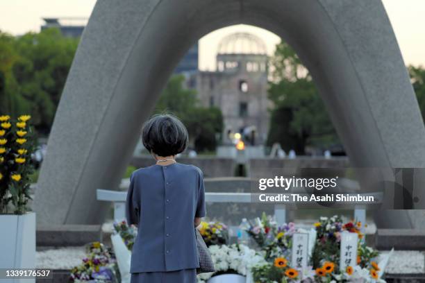 People pray for the victim prior to the peace memorial ceremony at the Hiroshima Peace Memorial Park on the 76th anniversary of the Hiroshima A-Bomb...
