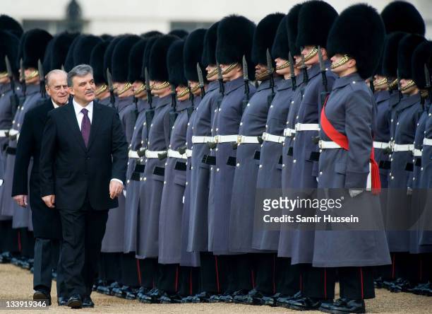 The President of Turkey Abdullah Gul inspects the Guard of Honour with Prince Philip, Duke of Edinburgh on Horse Guards Parade on November 22, 2011...