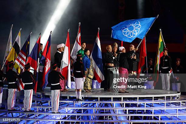 The Southeast Asian Games flag is handed over to Myanmar, the host of the 2013 Southeast Asian Games, during the Closing Ceremony on day 12 of the...