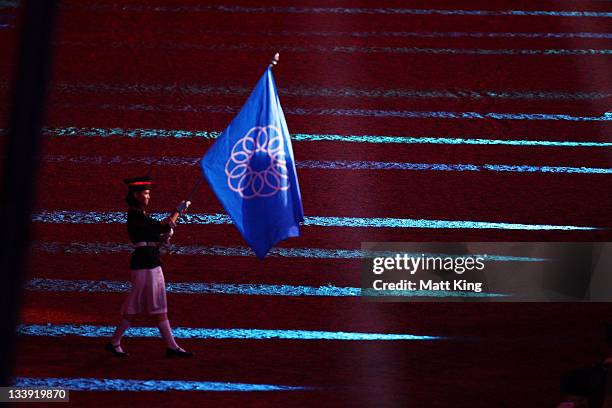 The Southeast Asian Games flag leaves the stadium during the Closing Ceremony on day 12 of the 2011 Southeast Asian Games at Jakabaring Sports...