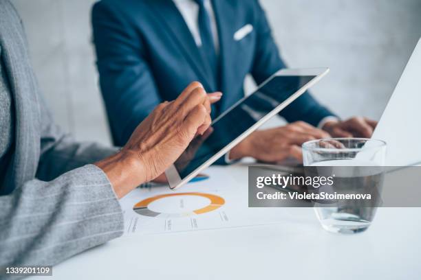 business people having a meeting in the office. - finance report stockfoto's en -beelden