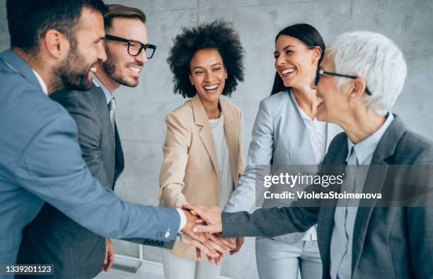 successful business team. - hand stack stock pictures, royalty-free photos & images