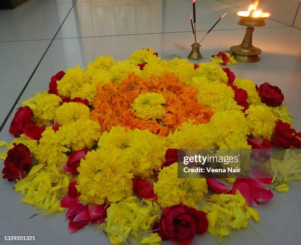 onam pookalam/flower carpet/onam festival/kerala - pookalam stock pictures, royalty-free photos & images