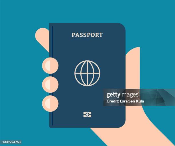 ilustraciones, imágenes clip art, dibujos animados e iconos de stock de mano sosteniendo un pasaporte regular - pasaporte