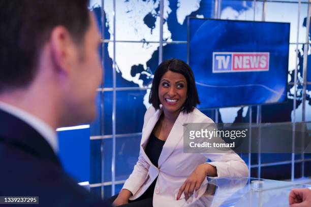 journalists preparing in a tv news studio - newscaster stock pictures, royalty-free photos & images