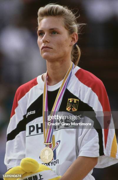 Katrin Krabbe of Germany stands on the podium with the Gold medal after winning the Women's 200 metres event at the 3rd International Association of...