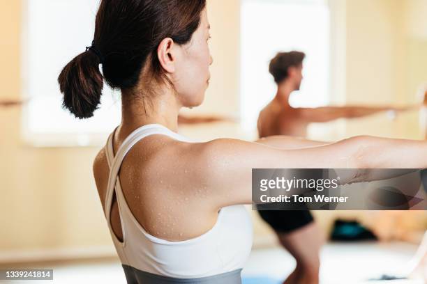 close up of woman sweating while doing yoga - hot yoga stock pictures, royalty-free photos & images