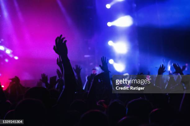 sea of hands under the yellow stage light - edm stockfoto's en -beelden