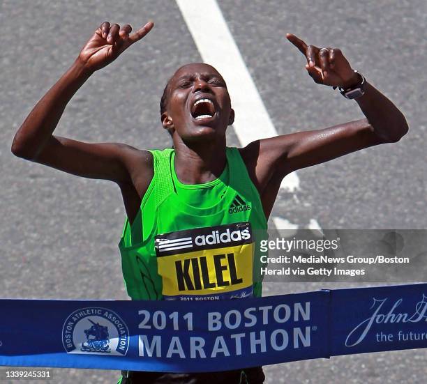 Caroline Kilel of Kenya crosses the finish line after winning the 115th Boston Marathon Monday, April 18, 2011. Staff Photo by Matt Stone