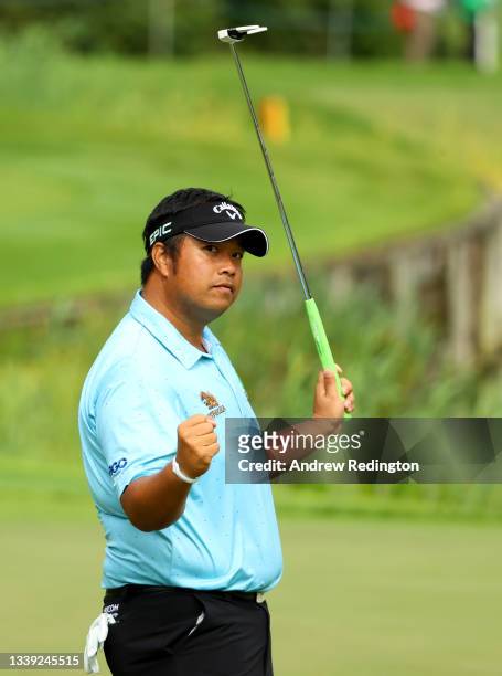 Kiradech Aphibarnrat of Thailand reacts after his putt on the 18th green during the first round of The BMW PGA Championship at Wentworth Golf Club on...