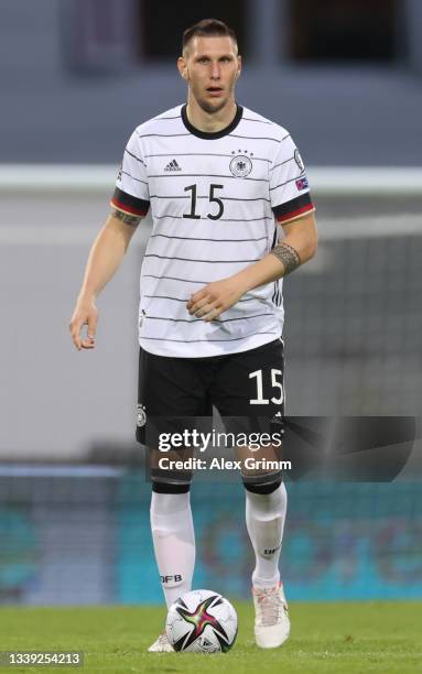 Niklas Suele of Germany controls the ball during the 2022 FIFA World Cup Qualifier match between Iceland and Germany at Laugardalsvollur National on...