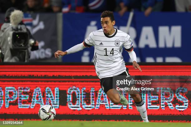Jamal Musiala of Germany controls the ball during the 2022 FIFA World Cup Qualifier match between Iceland and Germany at Laugardalsvollur National on...