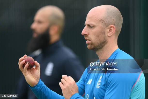 England bowler Jack Leach prepares to bowl as Moeen Ali looks on during England nets ahead of the 5th and final test match against India at Old...