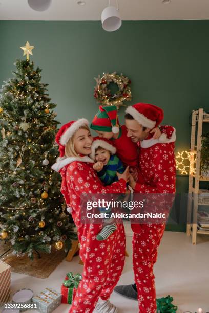 christmas morning in our home - pajamas stock pictures, royalty-free photos & images