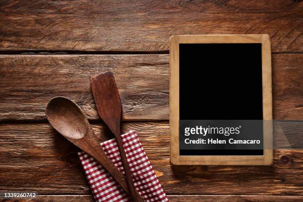 top view of kitchen utensil on a rustic wooden table with a blackboard - cereales stock pictures, royalty-free photos & images