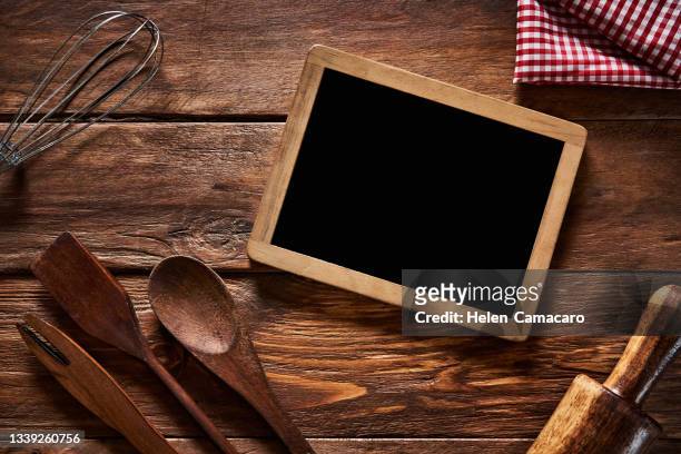 top view of kitchen utensil on a rustic wooden table with a blackboard - cereales stock pictures, royalty-free photos & images
