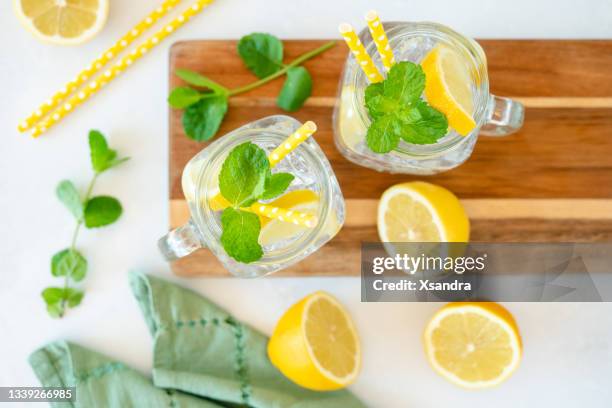 cold fresh mint lemonade in a mason jar - mason jar stock pictures, royalty-free photos & images