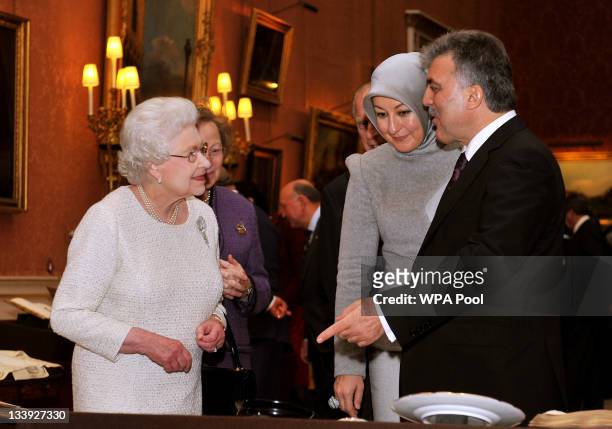 Queen Elizabeth II accompanies the President of Turkey Abdullah Gull and his wife Hayrunnisa, as they tour an exhibition of Turkish Artefacts from...