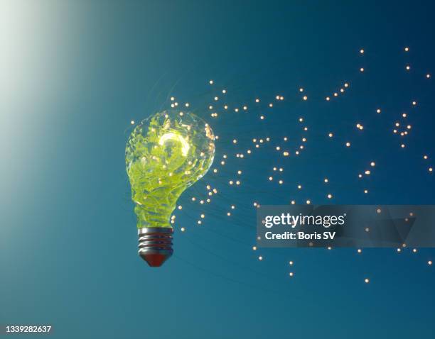 green light bulb - fireflies stockfoto's en -beelden