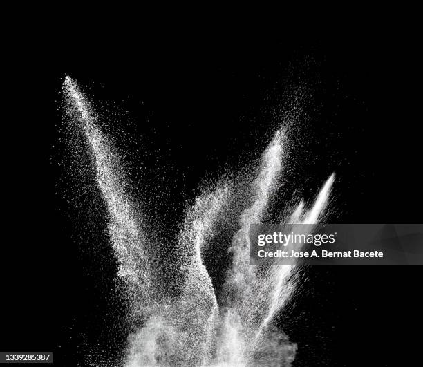 shock wave from an explosion of dust and smoke on a black background. - dynamite stock pictures, royalty-free photos & images