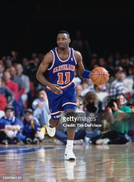 Terrell Brandon, Point Guard for the Denver Nuggets dribbles the basketball down court during the NBA Midwest Division basketball game against the...