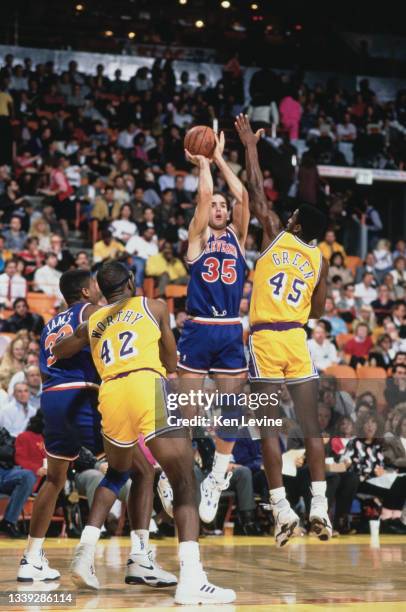 Danny Ferry, Power Forward for the Cleveland Cavaliers makes a jump shot as AC Green of the Los Angeles Lakers attempts to block during their NBA...