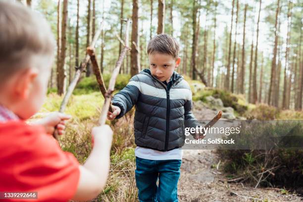 using their imagination - sword fight stock pictures, royalty-free photos & images