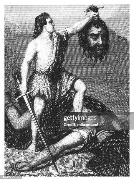 old engraved illustration of david kills goliath - david and goliath stock-fotos und bilder