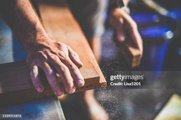 close up of a mans hands sanding a woodworking diy project - work atmosphere stock pictures, royalty-free photos & images