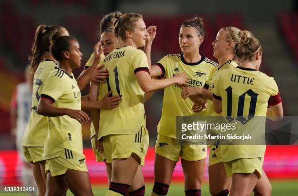 Vivianne Miedema of Arsenal FC celebrates with teammates after scoring their team's first goal during the UEFA Women's Champions League match between...