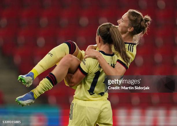 Vivianne Miedema of Arsenal FC celebrates with Katie McCabe after scoring their team's third goal and completing her hat-trick during the UEFA...