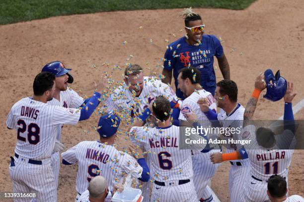 Pete Alonso of the New York Mets celebrates his walk-off home run during the seventh inning against the Washington Nationals in game two of a...