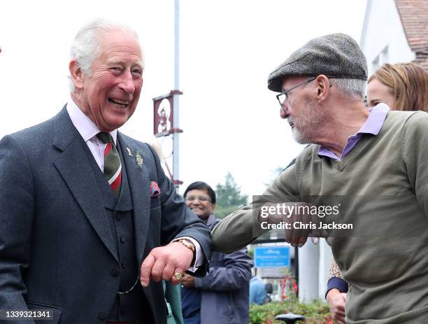 Prince Charles, Prince of Wales known as the Duke of Rothesay when in Scotland, meets members of the public as he visits Alloway main street on...