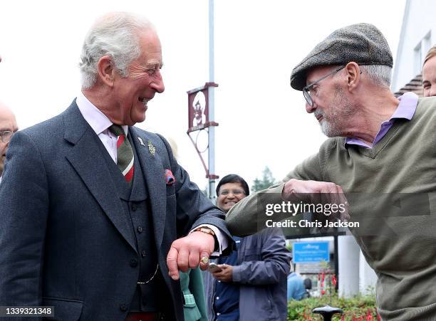 Prince Charles, Prince of Wales known as the Duke of Rothesay when in Scotland, meets members of the public as he visits Alloway main street on...