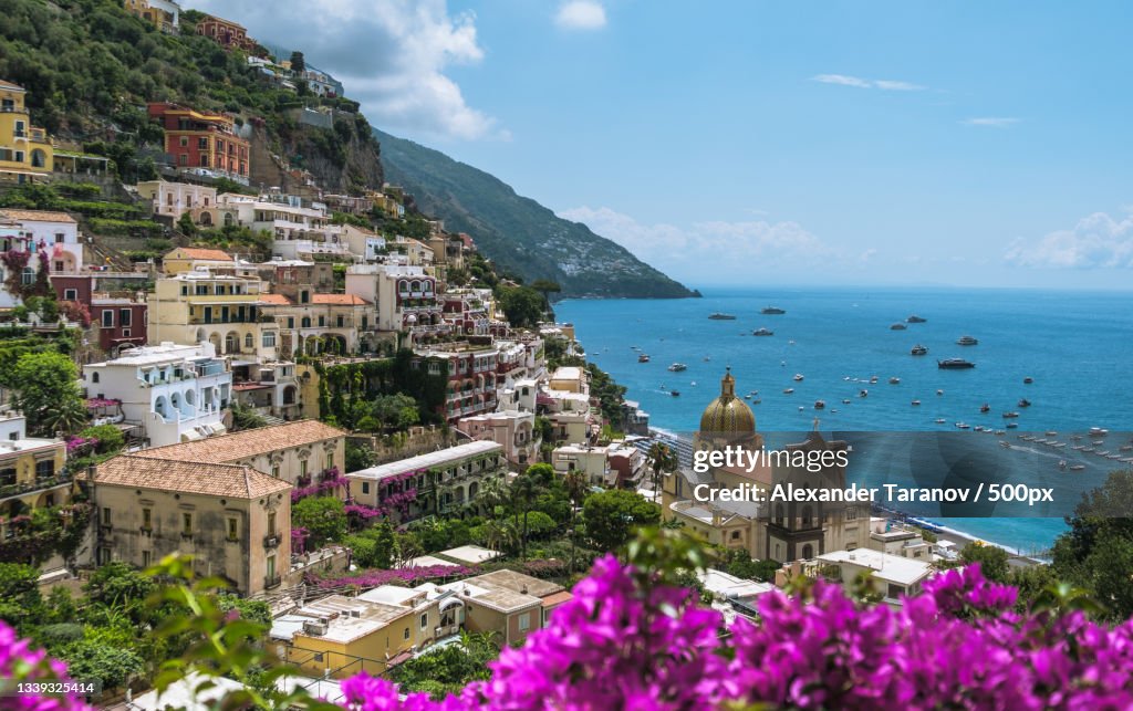 Scenic view of sea by buildings against sky,Amalfi,Salerno,Italy
