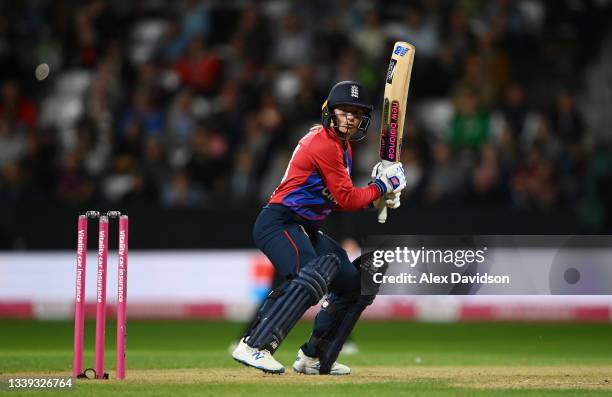 Danni Wyatt of England hits runs during the 3rd International T20 match between England and New Zealand at The Cooper Associates County Ground on...