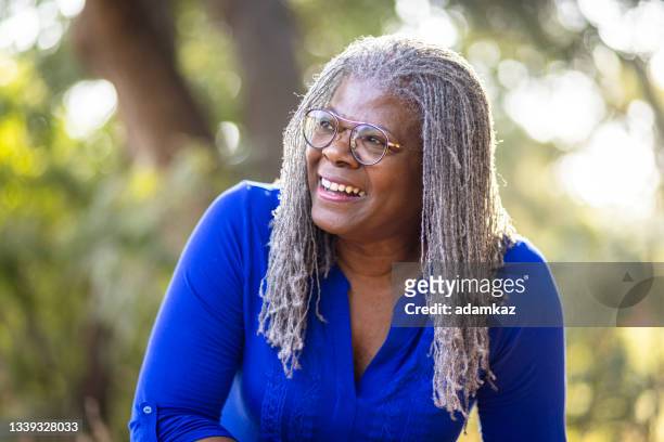 portrait of a beautiful senior black woman - locs hairstyle stock pictures, royalty-free photos & images