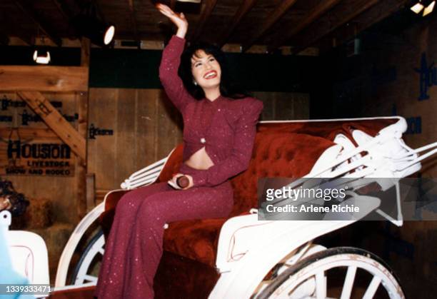 American singer Selena rides in a carriage during a performance at the Houston Livestock Show & Rodeo at the Houston Astrodome, Houston, Texas,...
