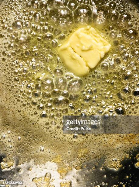 butter on the frying pan - lard stock pictures, royalty-free photos & images