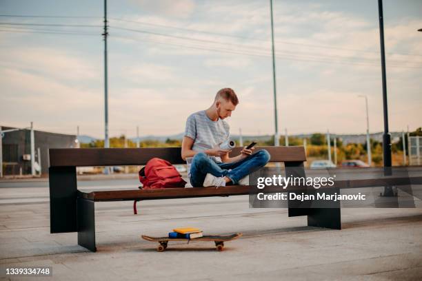 student outside college - bluetooth stock pictures, royalty-free photos & images