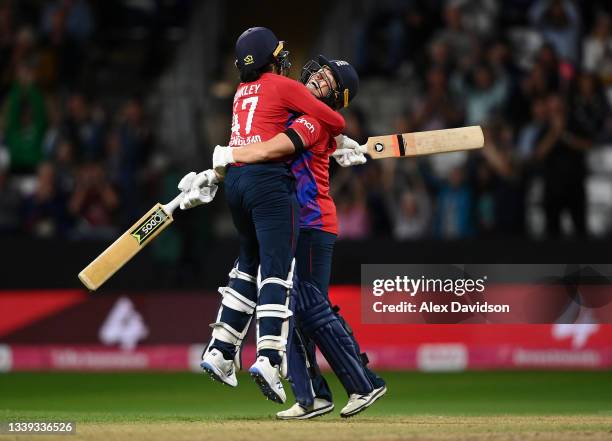 Sophia Dunkley and Katherine Brunt of England celebrate victory during the 3rd International T20 match between England and New Zealand at The Cooper...