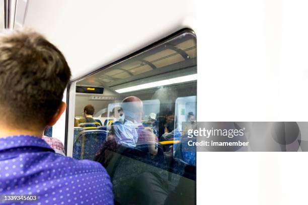 window reflection of people traveling on the train, background with copy space - sydney train stock pictures, royalty-free photos & images