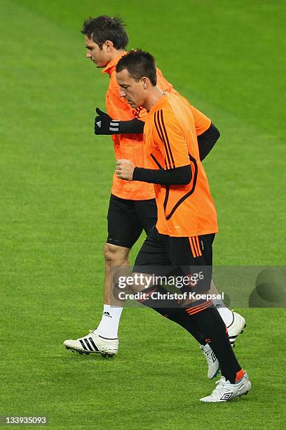 Frank Lampard and John Terry run during the Chelsea FC trainings session at BayArena on November 22, 2011 in Leverkusen, Germany.