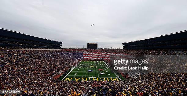 Michigan Stadium celebrates a salute to the Arm Forces and Veterans prior to the start of the game against Nebraska on November 19, 2011 in Ann...