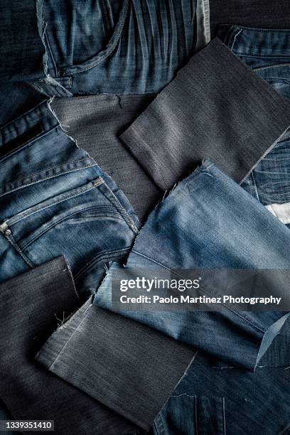 pieces of old used jeans - ripped jeans stock pictures, royalty-free photos & images