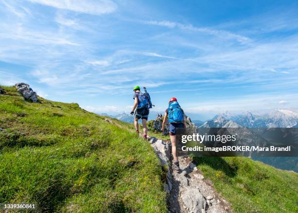 mountaineers hiking on the via ferrata mittenwalder hoehenweg, karwendel mountains, mittenwald, bavaria, germany - hiking across the karwendel mountain range stock pictures, royalty-free photos & images