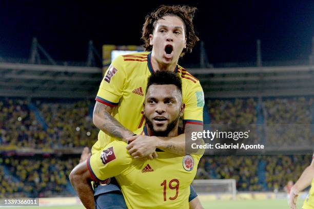 Miguel Borja of Colombia celebrates with teammate Juan Quintero after scoring the second goal of their team during a match between Colombia and Chile...