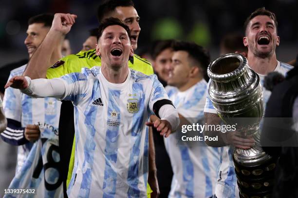 Lionel Messi of Argentina and Rodrigo De Paul of Argentina celebrate with the Copa America trophy after a match between Argentina and Bolivia as part...